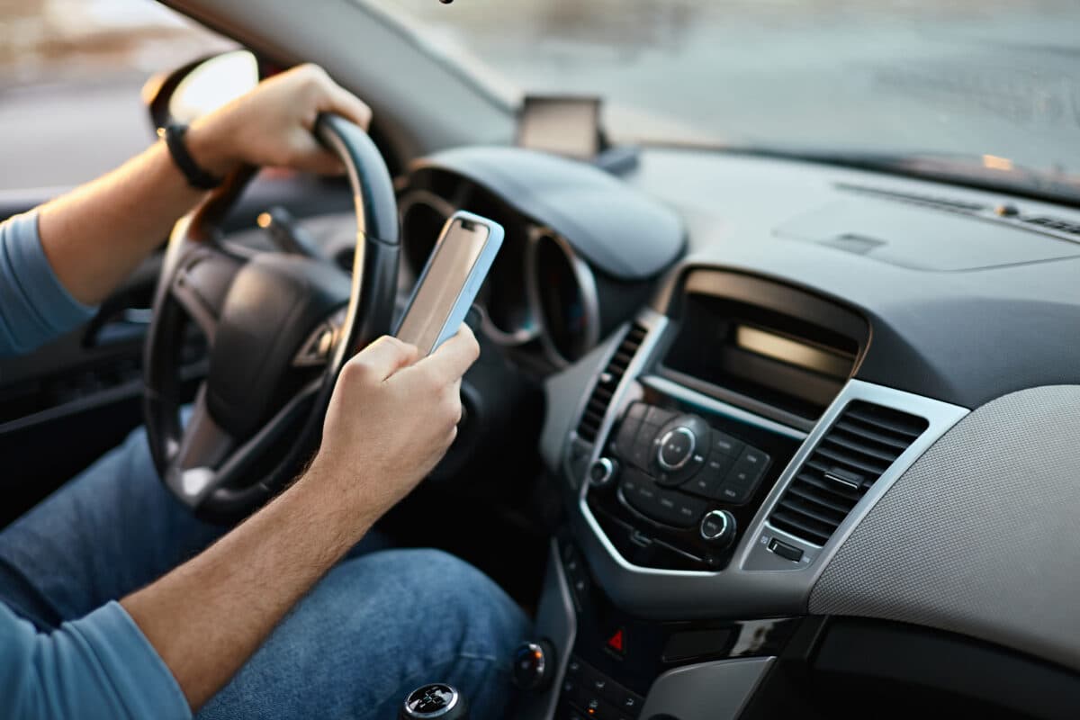 The Slovak court recognized that holding a phone in hand while driving is a violation of the law